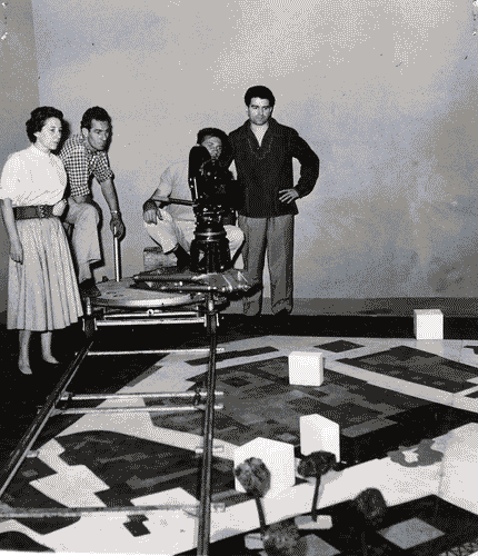 Image for X Triennale - Mostra dell'urbanistica - Preparazione del cortometraggio "una lezione di urbanistica" regia di Gerardo Guerrieri (a destra nella foto)