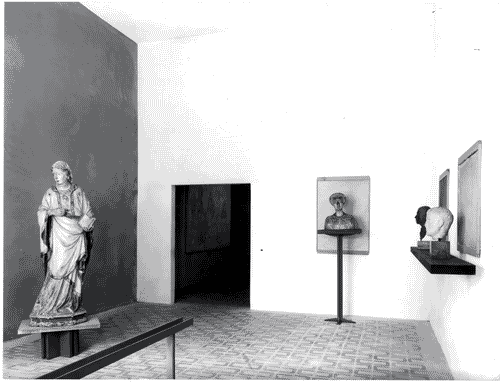 Image for XI Triennale - Mostra di museologia - Da sinistra: scultura lignea raffigurante la Madonna, busto femminile in marmo, testa e busto virile in marmo- Giuliano Cesari - Piero De Amicis - Pierangelo Pallavicini - Fulvio Raboni - Ferruccio Rezzonico